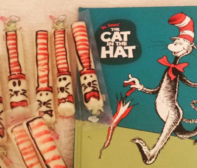 String cheese decorated to look like the cat in the hat, with a copy of the book