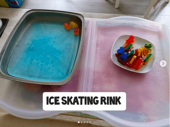 Mini skating rink for sensory play made by freezing water in a pan and freezing toys in ice cubes