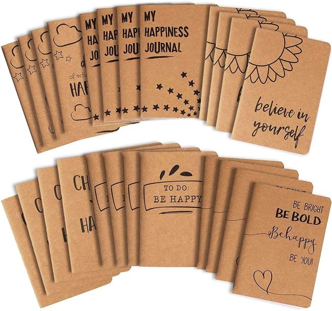 Selection of kraft-covered journals with happy sayings
