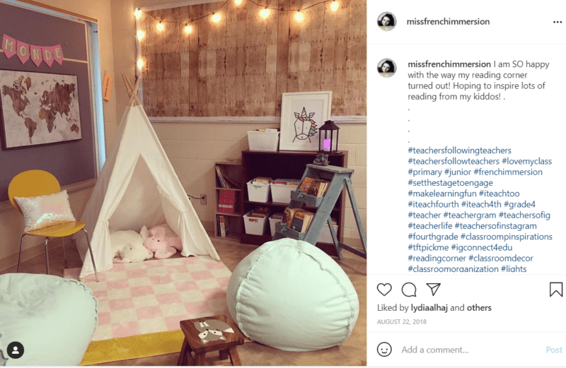 Reading corner in classroom with tent and hanging lights