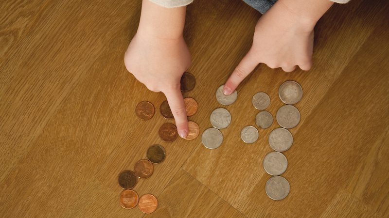 Student counting coins