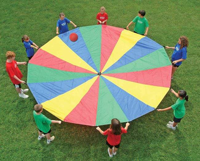 Children playing with a brightly-colored oversized parachute (Kids Gym Equipment)