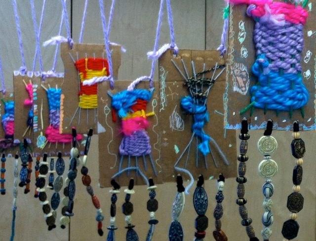 Woven design created with yarn on cardboard, with dangling beads (KIndergarten Art Projects)