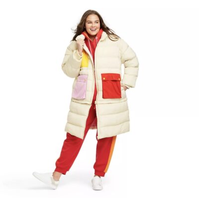 Woman wearing LEGO Collection x Target zip up puffy jacket with red and pink pockets