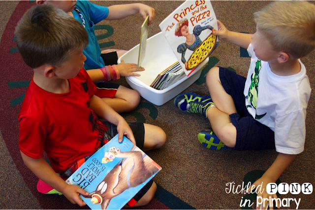 students help organize books in the classroom