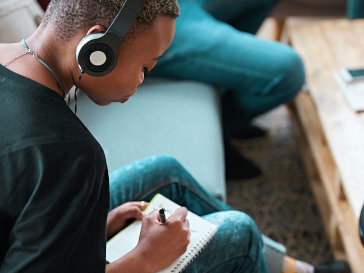 boy with headphones on listening to music, as an example of mindfulness activities for kids