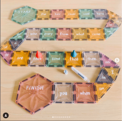 Magnetic tiles with sight words arranged in a board game maze as an example of sight word activities