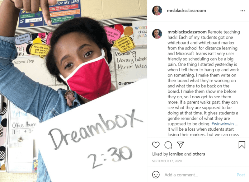 Teacher wearing red mask holding sign sharing remote teaching hack