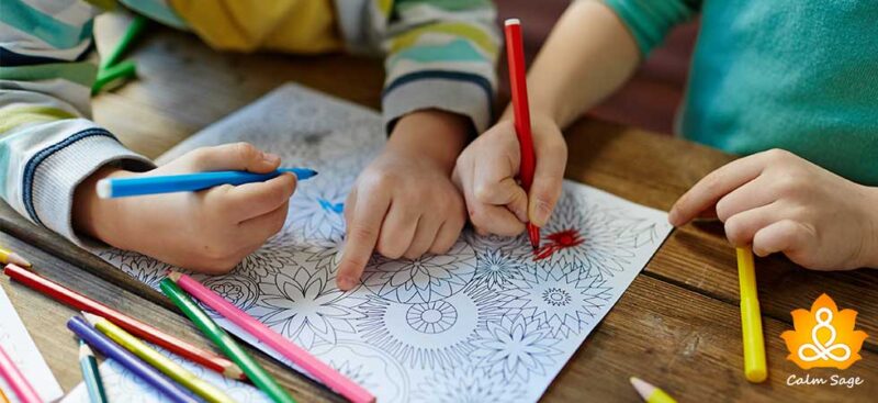 two kids coloring mandalas with markers, as an example of mindfulness activities for kids