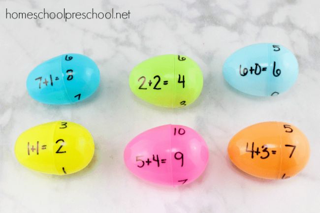 Plastic Easter eggs with addition math facts written on one half and sums on the other half