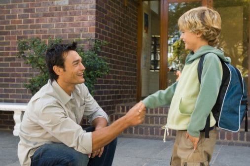 Teacher greeting student