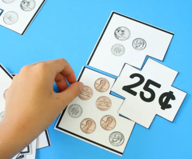 Child assembling printable puzzle showing coin combinations adding up to 25 cents (Money Skills for Kids)