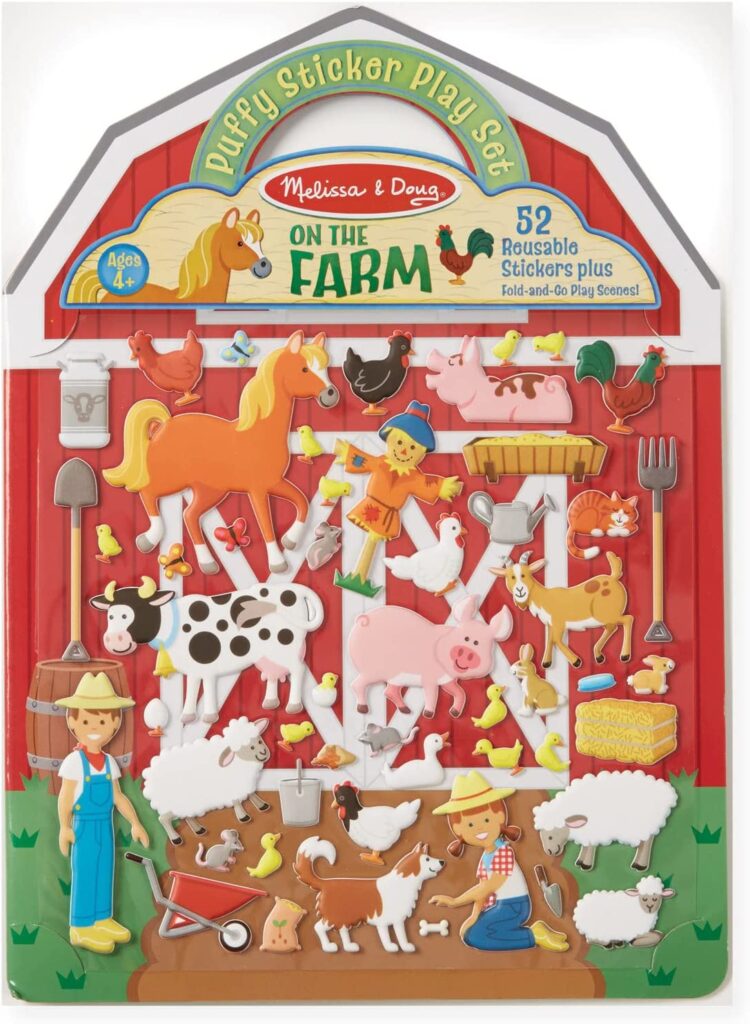 A book cover is shaped like a barn and has puffy stickers on it that look like farm animals and a farmer.