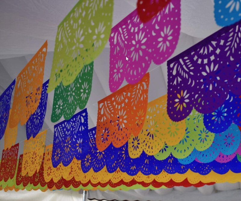Colorful Papel Picado handing from the ceiling.