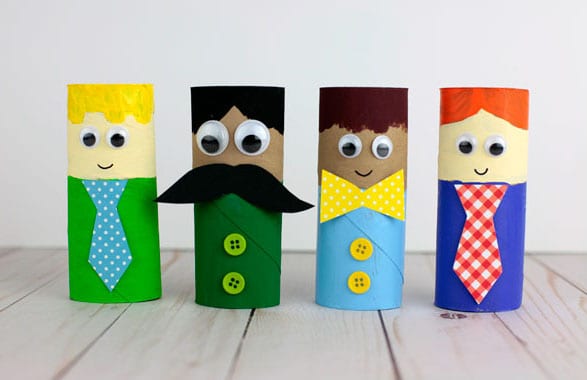 Paper roll figurines decorated like dad, as an example of the best Father's Day crafts for kids