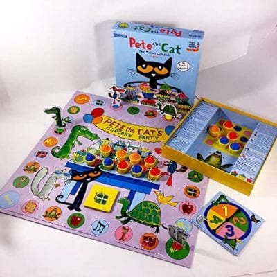 Pete the Cat The Missing Cupcakes game box, board, spinner, and multicolored cupcake game pieces laid out to demonstrate preschool game play