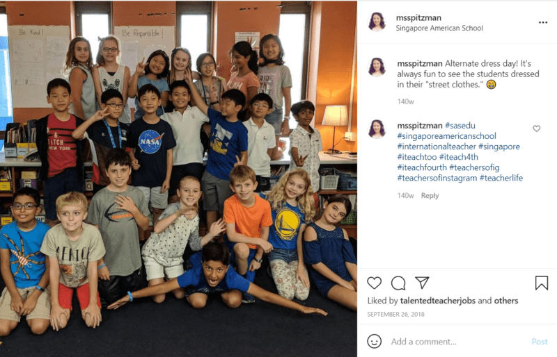 Students in classroom taking group photo at Singapore American school