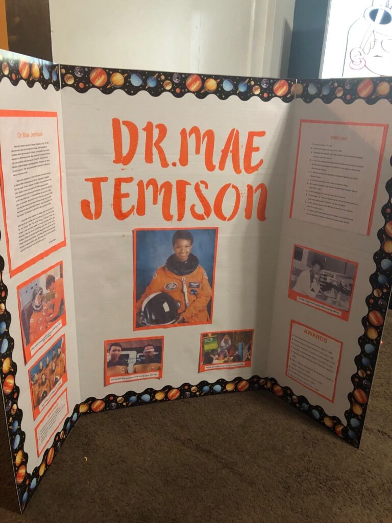 Poster board project with photo and information about Dr. Mae Jemison and planets bulletin board trim