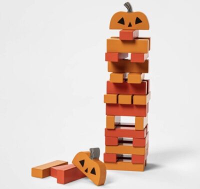 Orange stacking Jenga game with pumpkin shaped topper