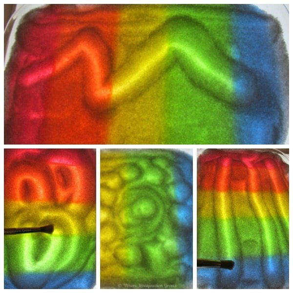 A rainbow colored tray of sand for children to practice writing skills on