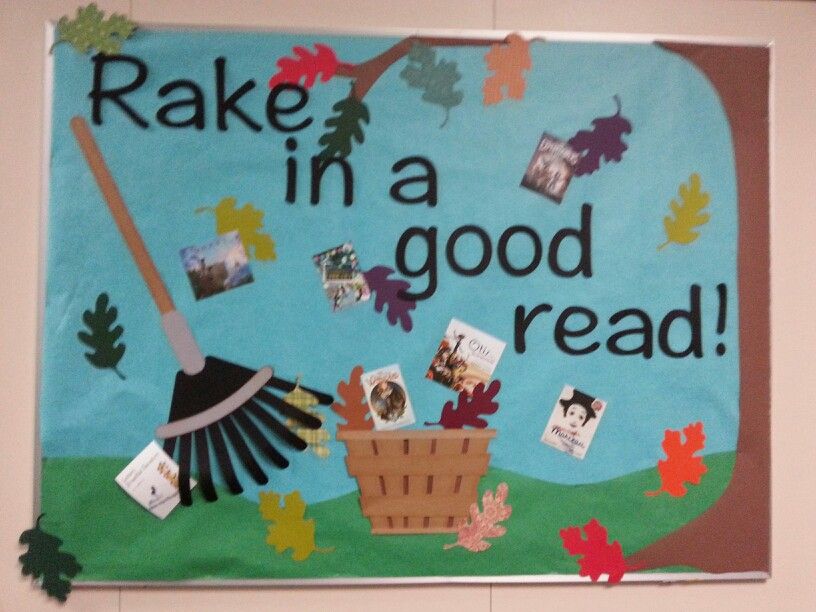 A bulletin board says rake in a good read! It has leaves and books on it.
