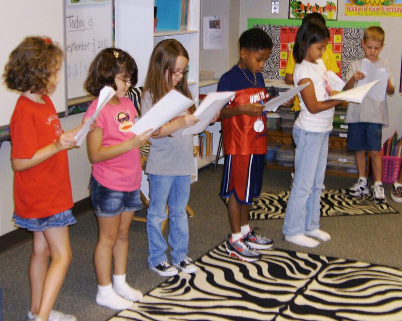 children performing a readers theater in the classroom