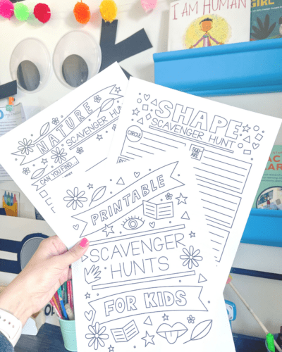 Printed out scavenger printables being held up, as an example of free last day of school printables