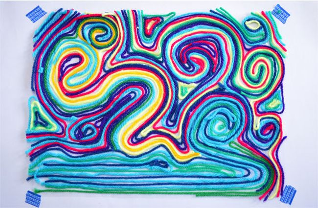 Colorful yarn arranged in an abstract pattern to create art (Second Grade Art Projects)
