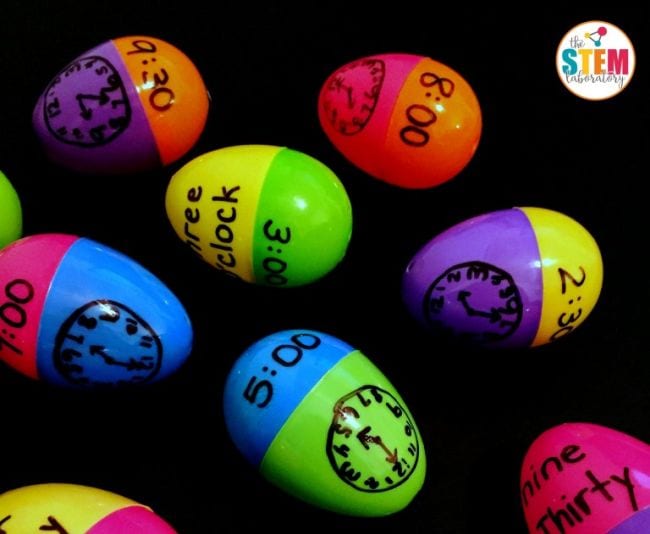 Plastic eggs with analog clocks on one side and digital times on the others