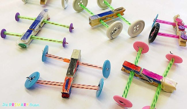 Simple cars made from clothespins and drinking straws