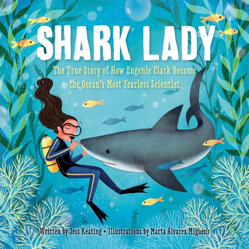 Çocuklar için köpekbalığı kitaplarına bir örnek olarak, bir köpekbalığının yanında su altında kadın tüplü dalgıç illüstrasyonlu Shark Lady'nin kitap kapağı