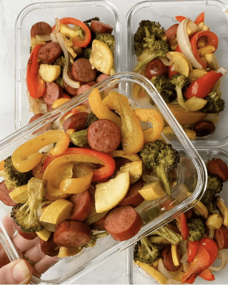 Sausage, peppers, and veggies in glass meal prep boxes 