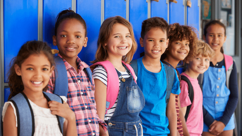 Elementary students standing in front of lockers - - Alternative to Suspension