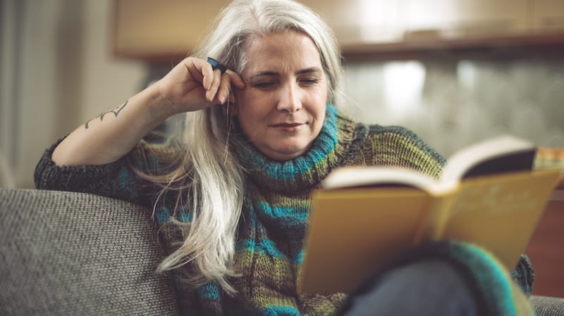 Mature woman at home reading