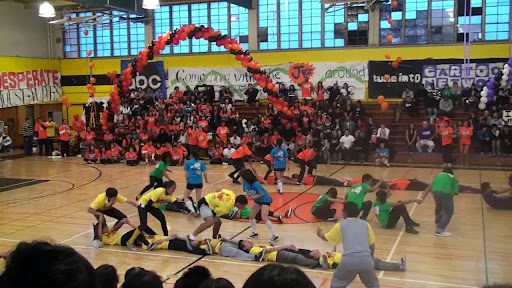 Children playing game in gym, as an example of pep rally activities and games