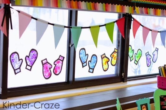 Stained glass mittens hung on classroom window.