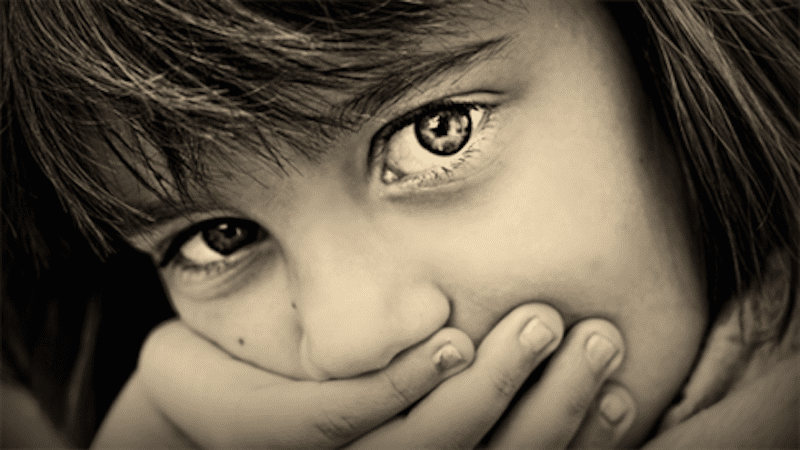 close up of young girl who experienced trauma