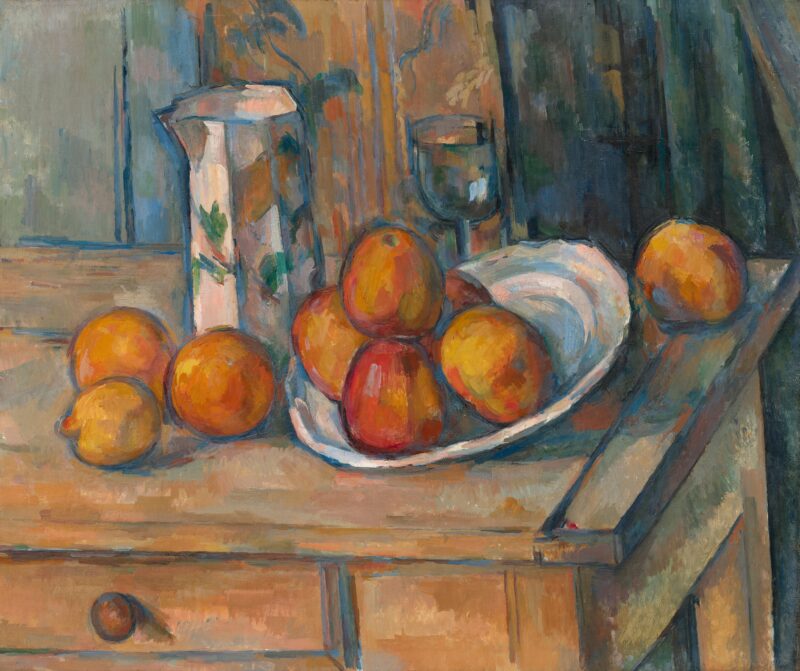 A painting shows a close-up of oranges and a pitcher on a table.