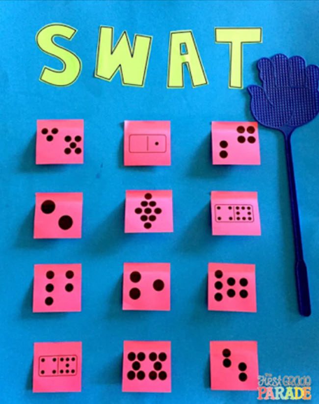 A flyswatter with a selection of sticky notes with various number patterns printed on them, and the word SWAT.