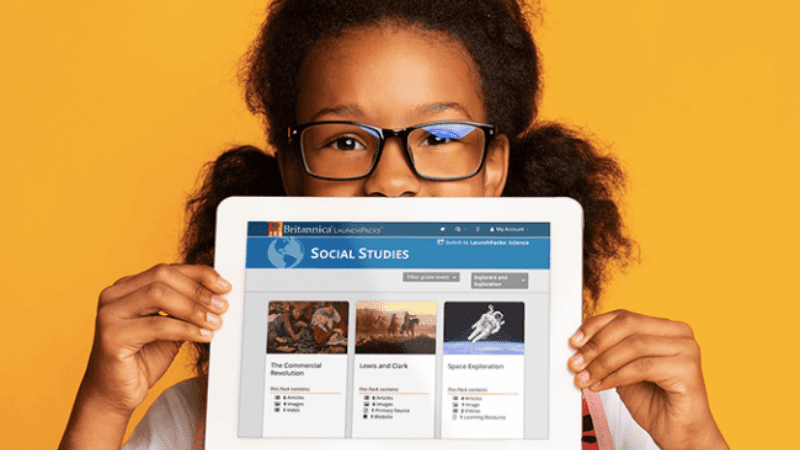 African American girl wearing glasses, holding iPad summer school resources from Britannica LaunchPacks