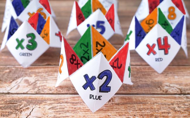 Colorful paper cootie catchers with multiplication facts