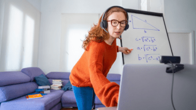 Female teacher wearing headset recording a math lesson on video