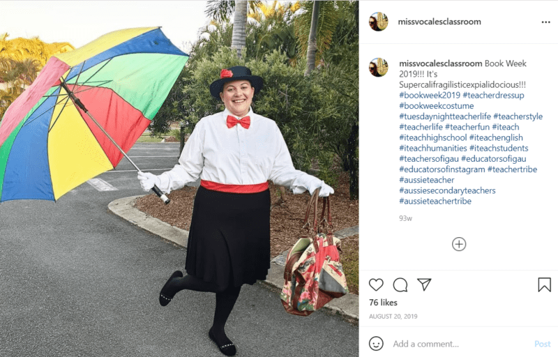 Teacher outside holding a rainbow umbrella dressed as Mary Poppins