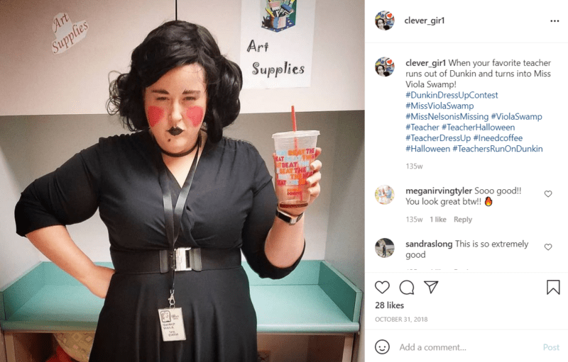 Teacher dressed up as Miss Viola Swamp holding an empty Dunkin Donuts cup