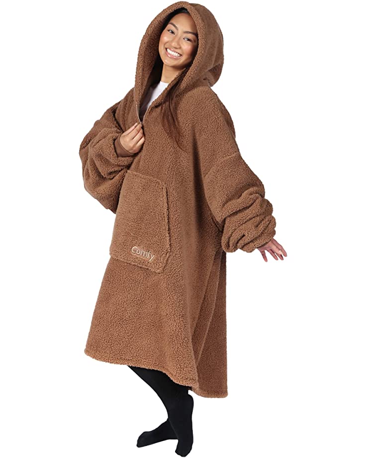 Woman wearing a brown 'teddy bear' style version of the Comfy wearable blanket