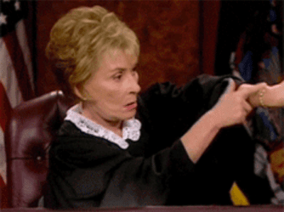 Judge Judy pointing at watch
