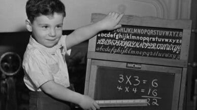 Black and white photograph student doing times tables - 30 Things Today's Students Will Never Understand