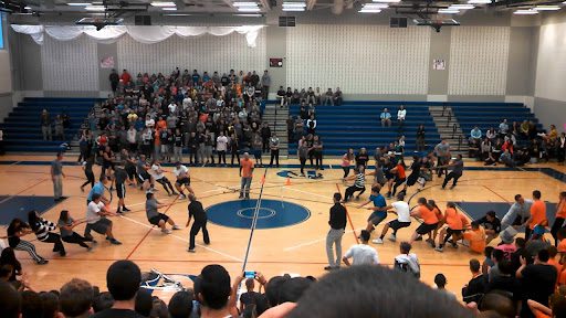 Students playing four-way tug-of-war