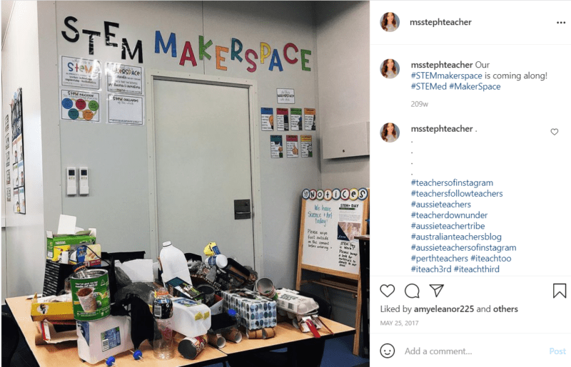 Classroom with cluttered table and Stem Makerspace letters on wall