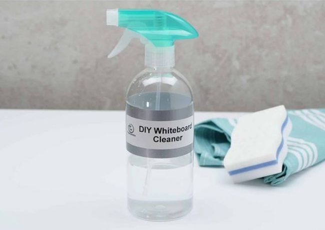 Spray bottle labeled DIY Whiteboard Cleaner with sponge and cloth (Whiteboard Hacks)